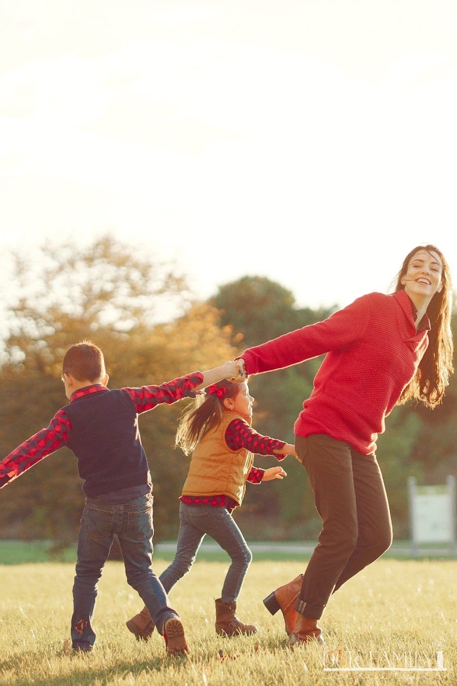 mom playing with kids outside