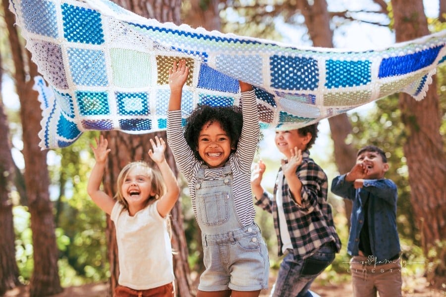 Diverse Group of Kids Having Fun Together in Forest