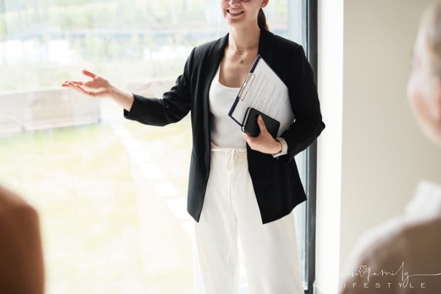 real estate agent showing a couple a house for sale
