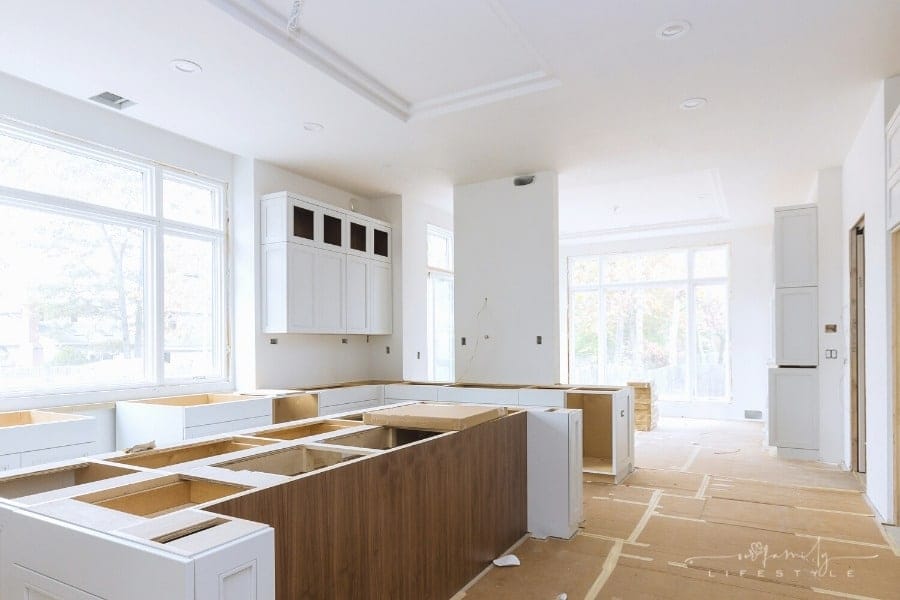 bare kitchen cabinets being installed for remodel