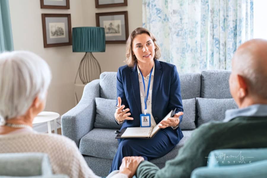 Social Worker Talking to Senior Couple at Home