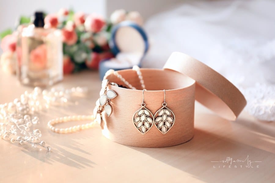 Collection of Jewelry Pieces in small, round Jewelry Box