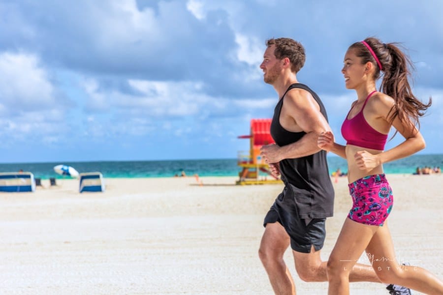 Couple Running Together at the Beach