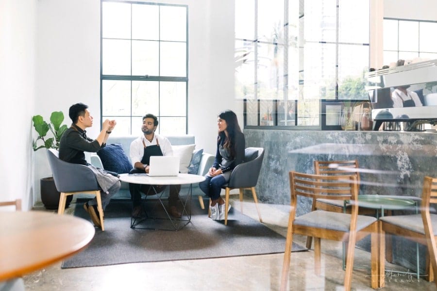 family business owners discussing running a cafe