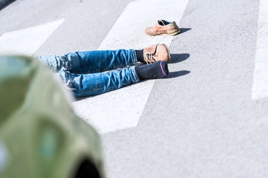 Traffic accident. Young man hit by a car