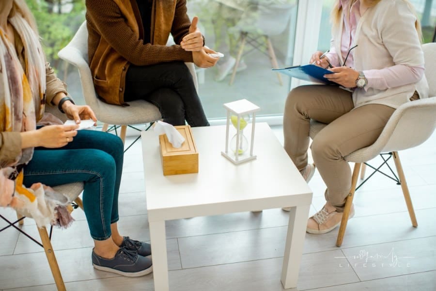Couple Sitting with Psychologist during Therapy session