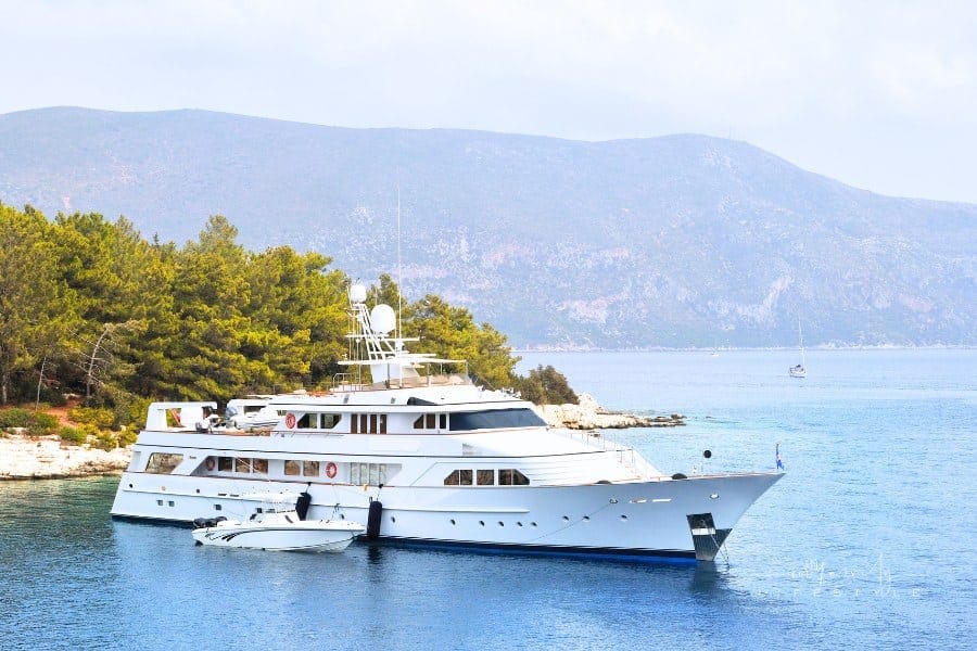 luxury yacht anchored near land penisula