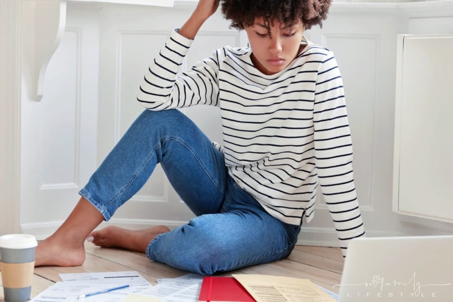 woman-checks-reports-while-working-home-business